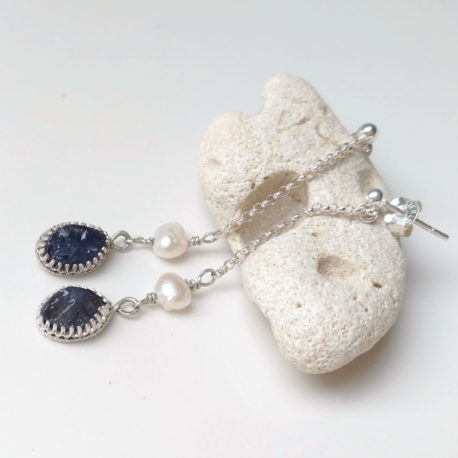 raw iolite dangles in sterling silver, on a chain, with white pearl