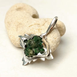 Raw tsavorite green garnet pendant in sterling silver