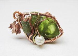 Raw peridot crystal pendant copper wire wrapped, with a green genuine freshwater pearl